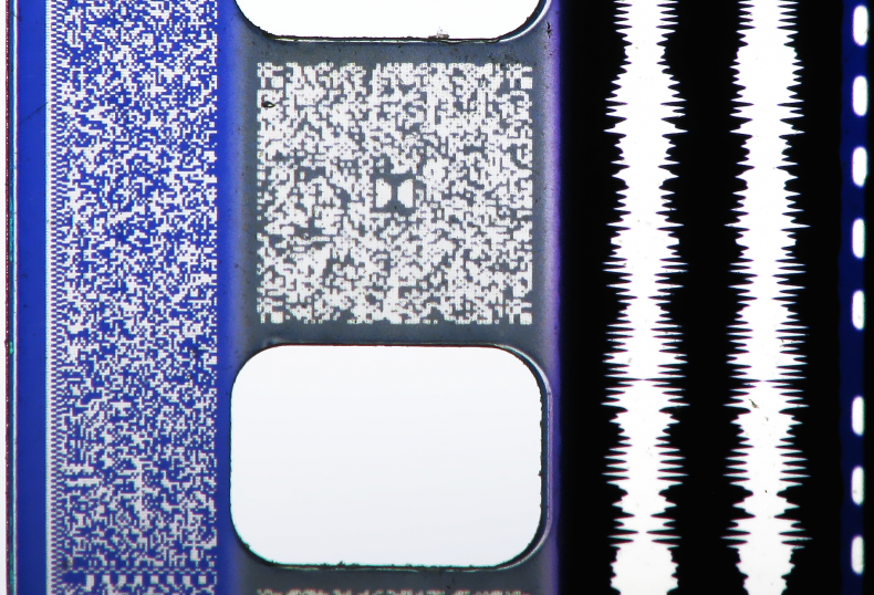 Macro of 35mm film and audio tracks: Sony SDDS, Dolby Digital, analog Optical and DTS time code.